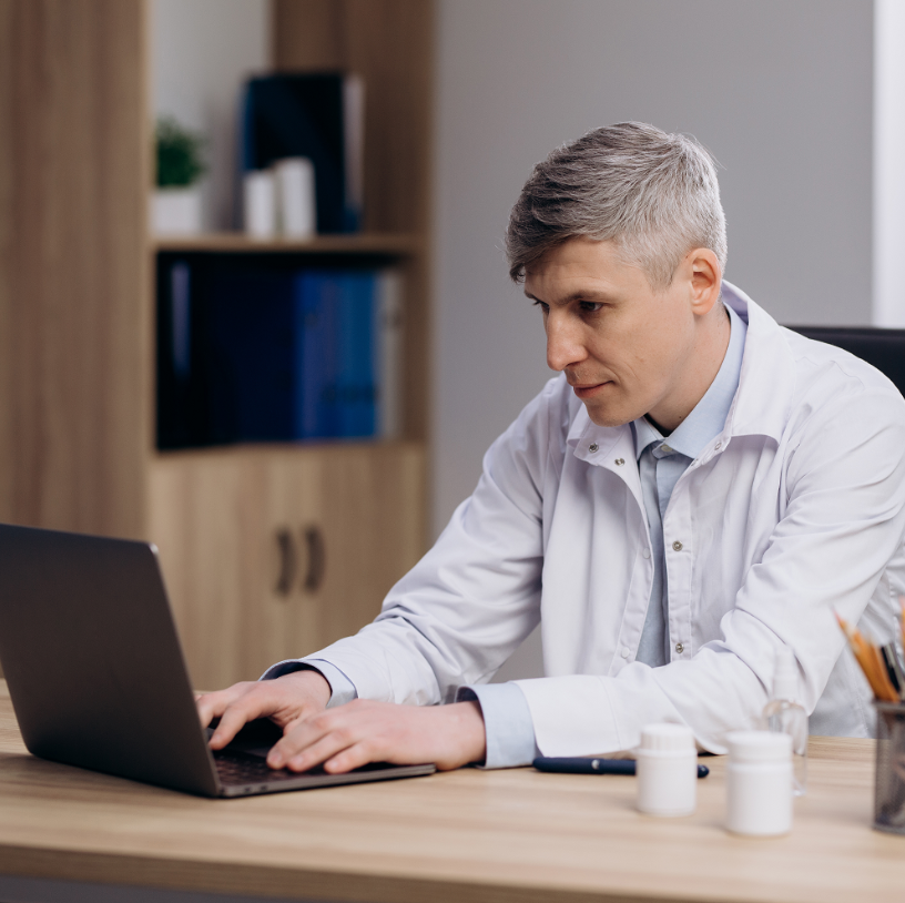 A man is working on his laptop