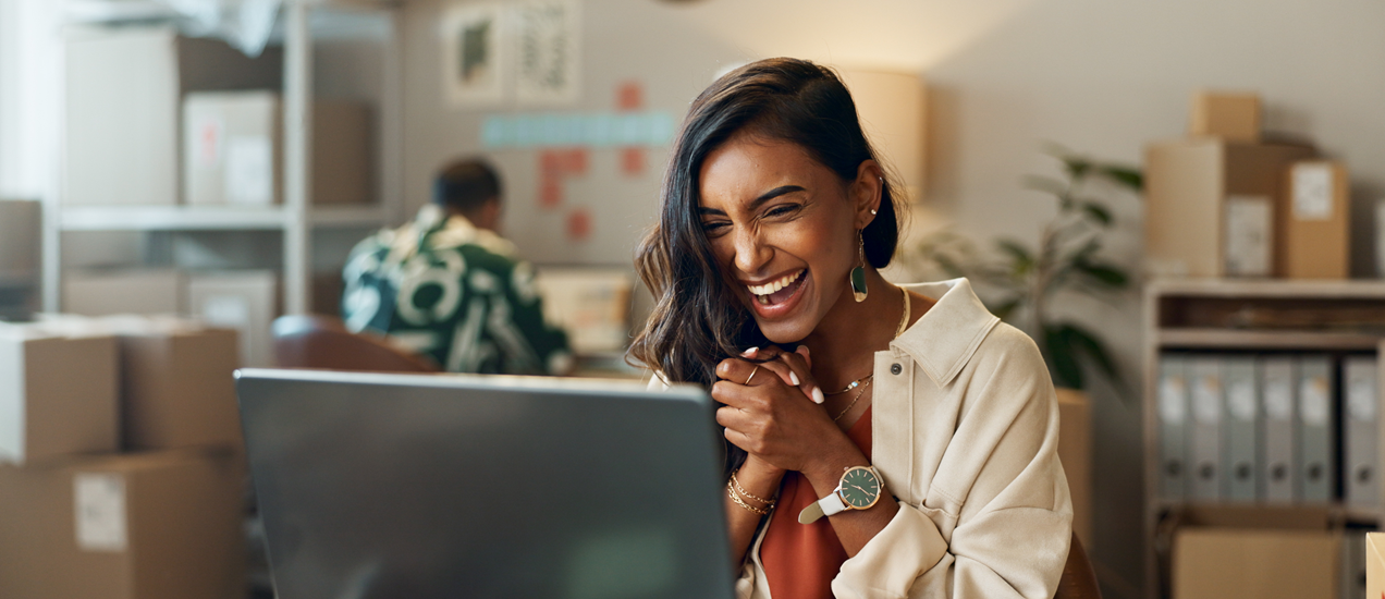 A happy customer looking at her screen