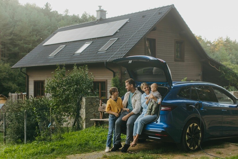 A family sitting together outside their home