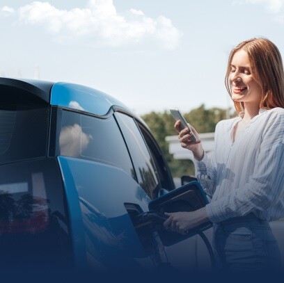 A woman refueling her automobile