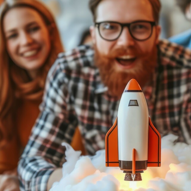 a man looking at a rocket ship launch toy