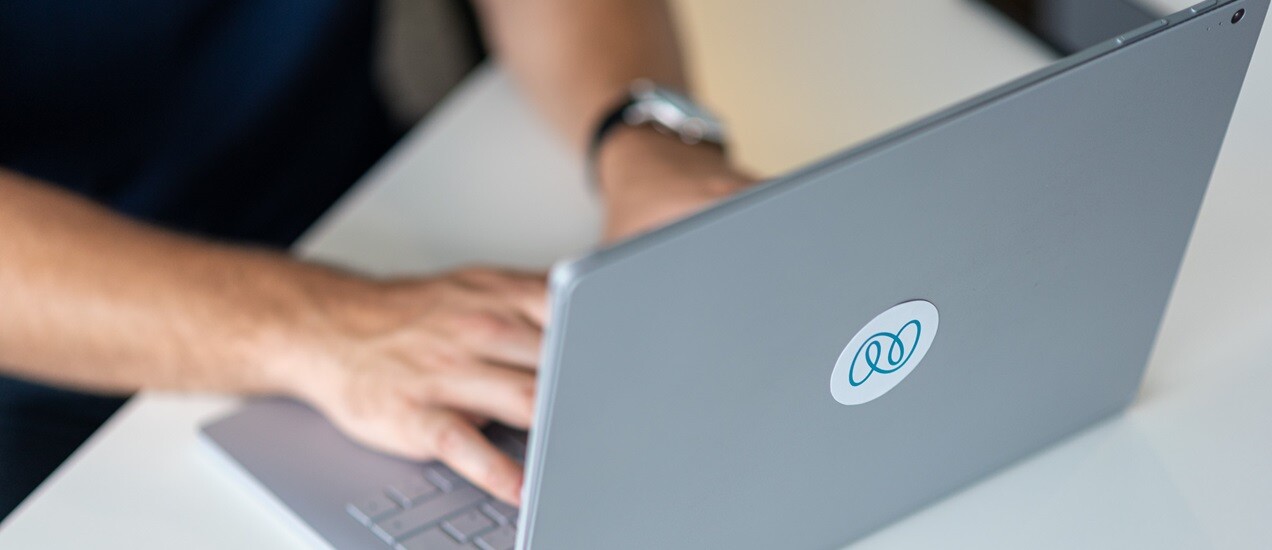 Hands of a person working on a Nagarro laptop