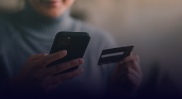 A woman using her credit card on the phone